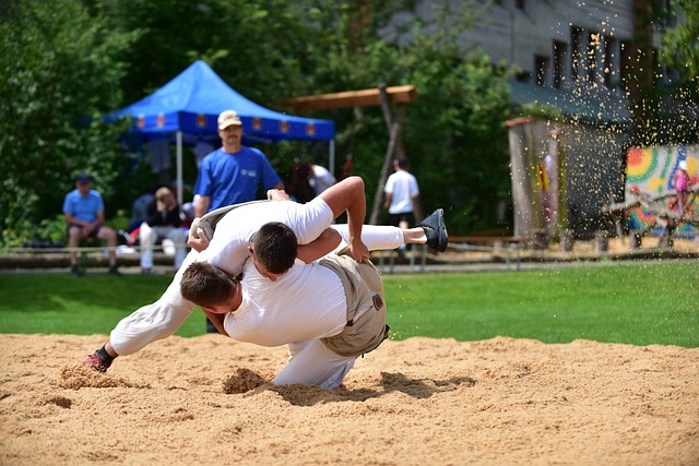 A martial arts student sitting, tying an orange belt, symbolizing progress and community
